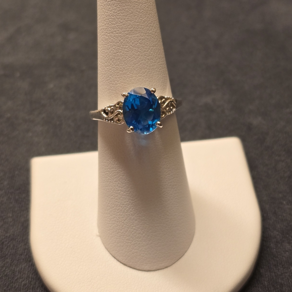 .925 Sterling Silver Lab Grown Blue Stone Ring. Size 7